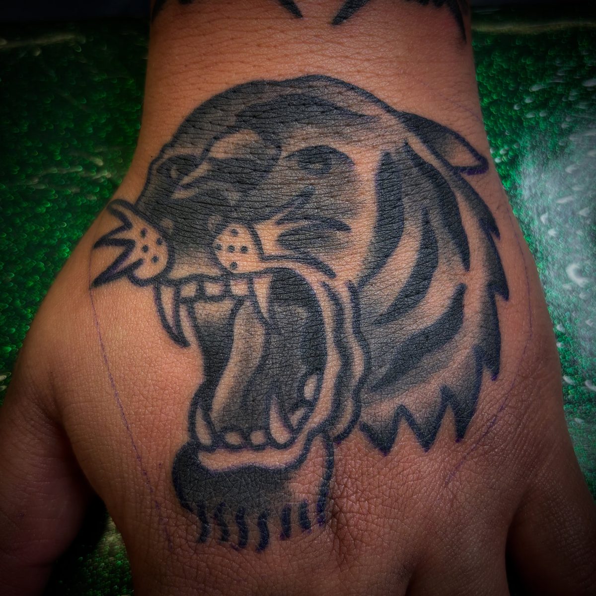 Bold black panther tattoo with heavy black saturation and strong contrast