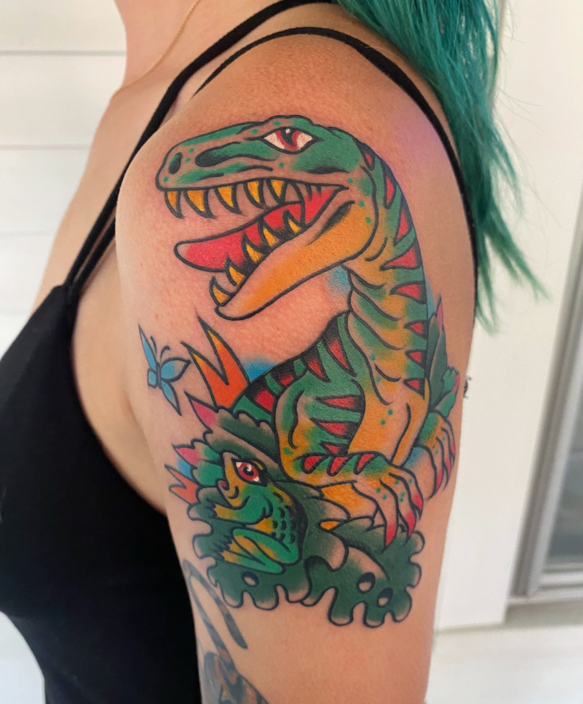 Color dinosaur tattoo with saturated illustrative details