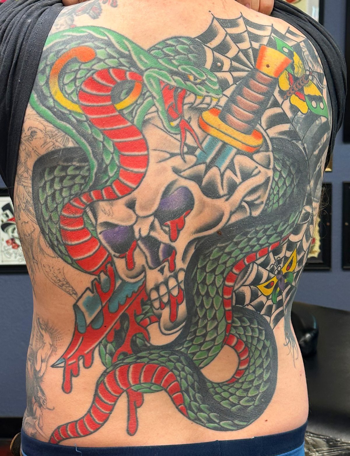 Large custom Japanese dragon and snake back tattoo in saturated color